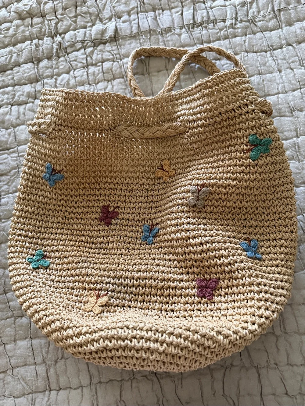 Darling raffia mini backpack with pastel crochet butterflies